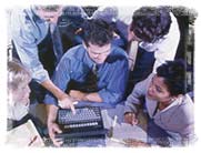 The eWebs.net team gathered around a single keyboard